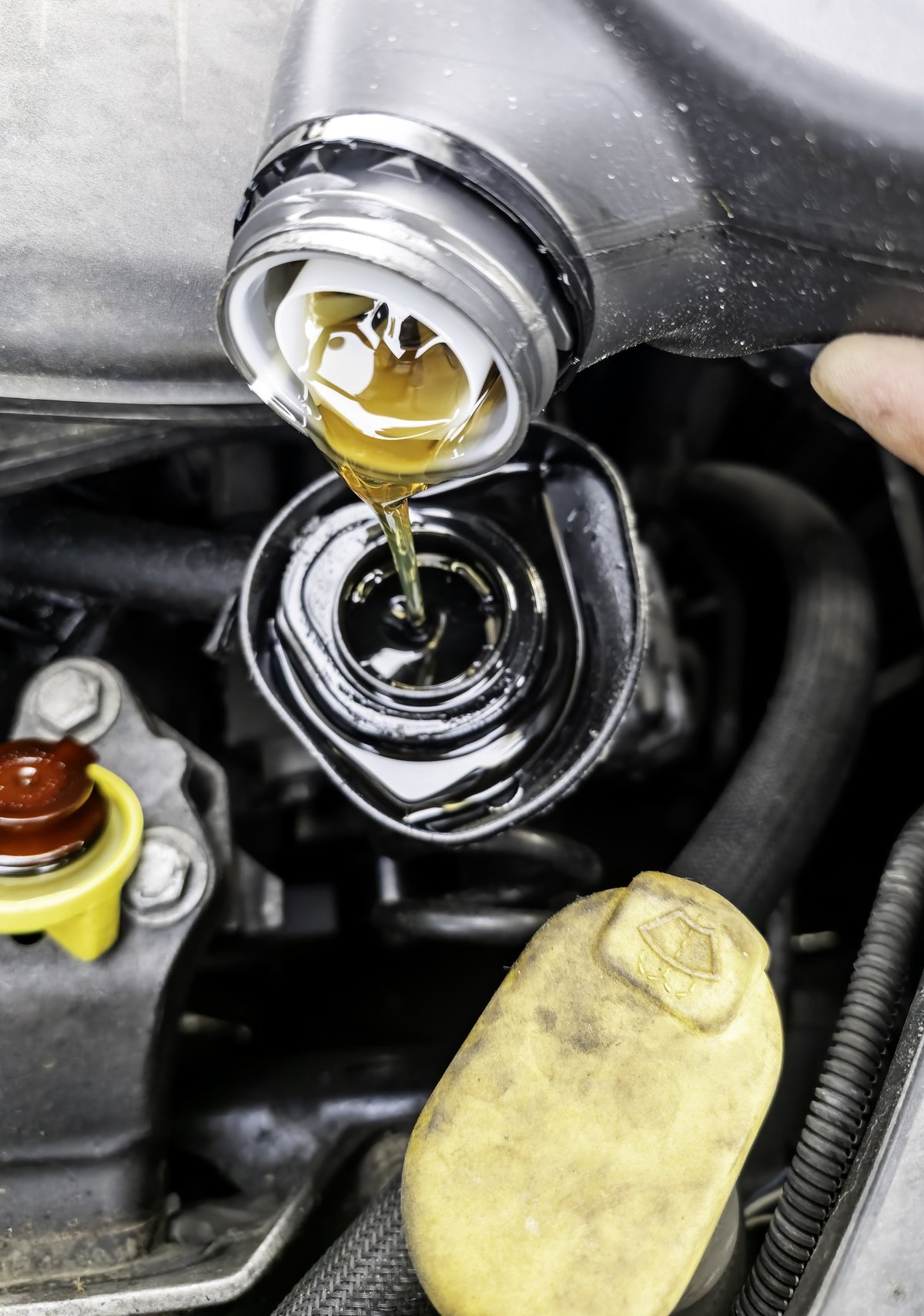 Oil being poured into an engine